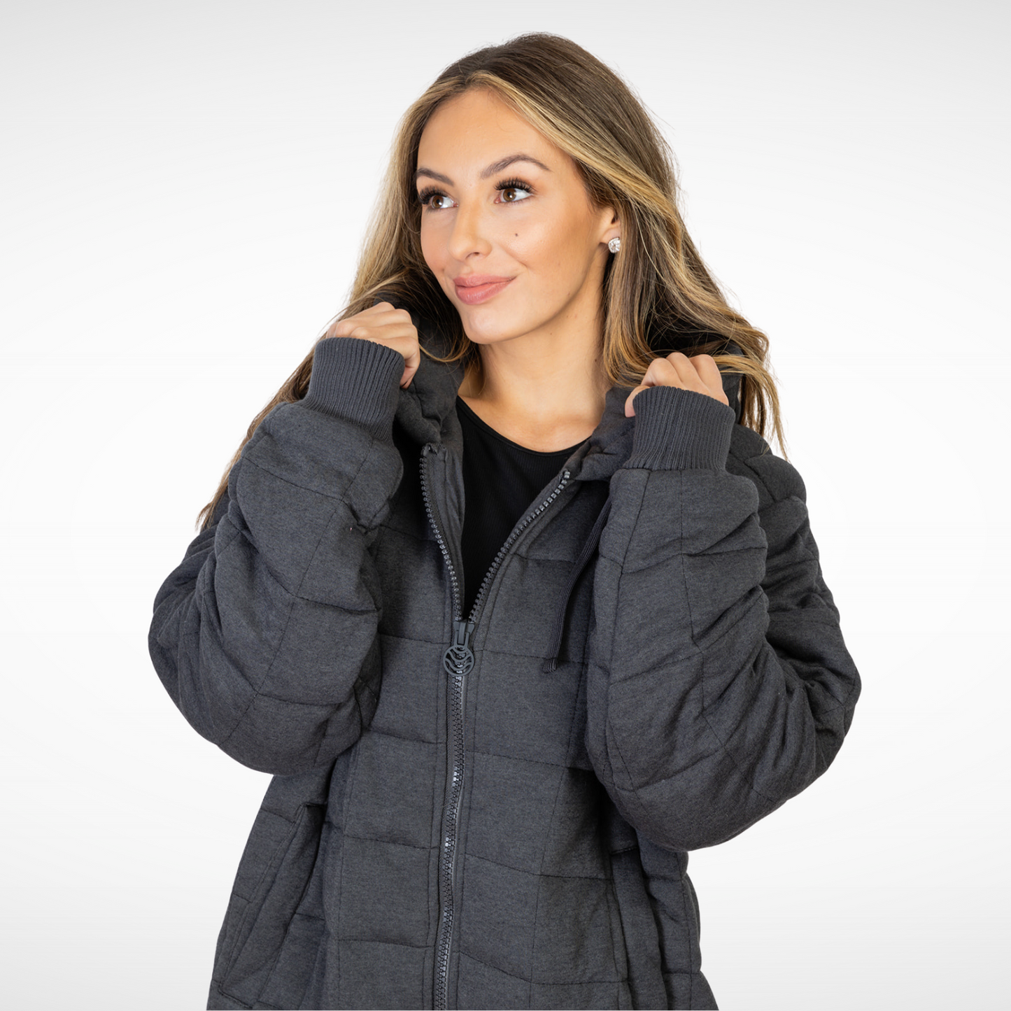 woman wearing cozy charcoal weighted therahoodie